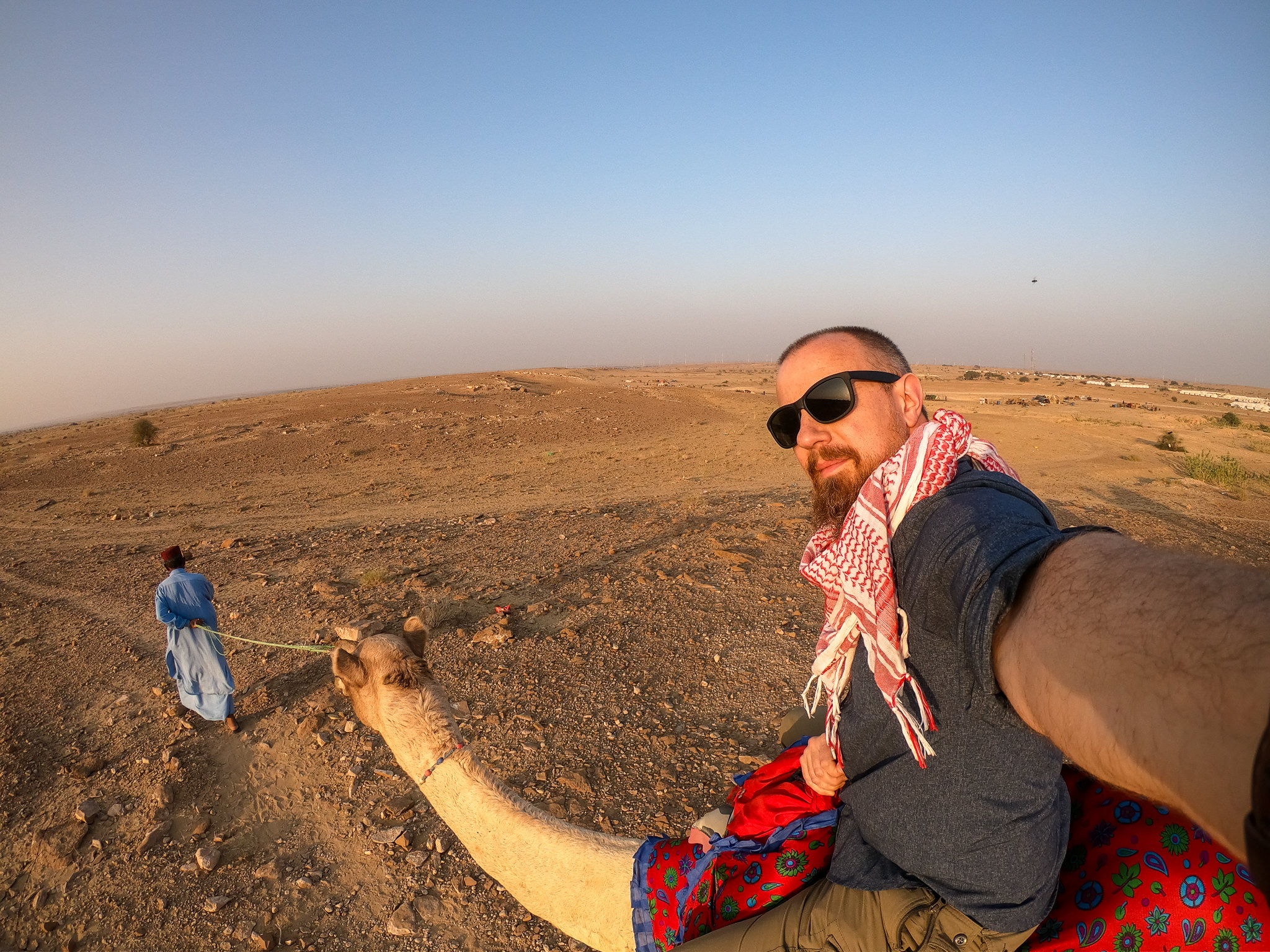 Your host, PhotoJoseph, braving a camel ride! It kinda hurts… but it's totally worth it!